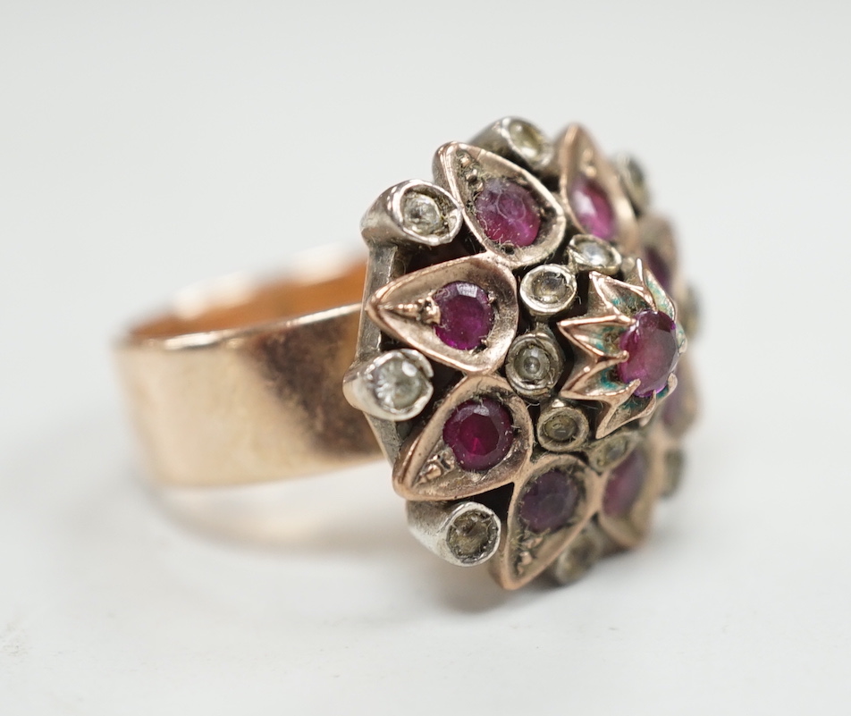 An antique yellow metal and two colour paste set cluster dress ring, size O, gross weight 10.8 grams.